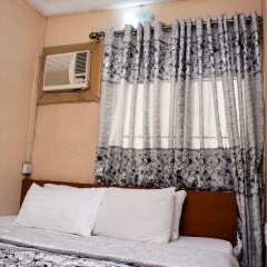 Отель Maxton Suites Magodo комната для гостей