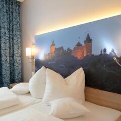Отель Ringhotel Loew's Merkur Германия, Нюрнберг - отзывы, цены и фото номеров - забронировать отель Ringhotel Loew's Merkur онлайн комната для гостей фото 3