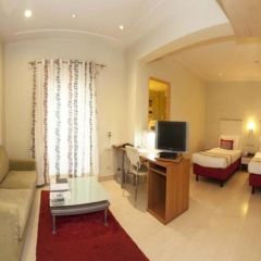 Отель Avalon Courtyard Residence Suites комната для гостей