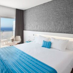 Suitopía Sol y Mar Suites Hotel комната для гостей