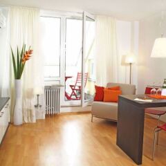 Апартаменты Frederics Serviced Apartments Мюнхен комната для гостей фото 2