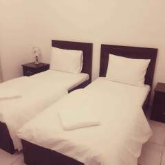 Отель Al Bishr Hotel Apartments ОАЭ, Шарджа - отзывы, цены и фото номеров - забронировать отель Al Bishr Hotel Apartments онлайн комната для гостей фото 2