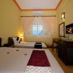 Отель Hoian Salute Hotel and Villa Вьетнам, Хойан - отзывы, цены и фото номеров - забронировать отель Hoian Salute Hotel and Villa онлайн комната для гостей фото 3