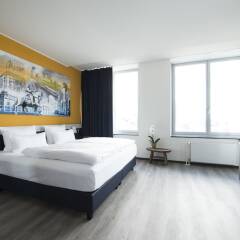 Отель carathotel Düsseldorf City комната для гостей фото 5