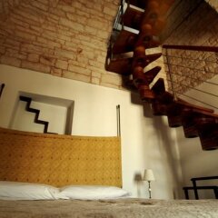 Отель Trulli Pietradimora B&B Альберобелло сейф в номере
