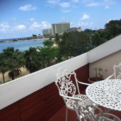 Отель SandCastles Deluxe Beach Resort Ямайка, Очо-Риос - отзывы, цены и фото номеров - забронировать отель SandCastles Deluxe Beach Resort онлайн балкон