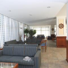 Jacaranda Hotel Apartments интерьер отеля