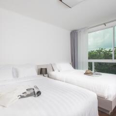 Отель The WIDE Condotel - Phuket Семейный люкс с различными типами кроватей фото 2