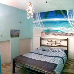 Отель Maya Cha'an Guesthouse Мексика, Канкун - отзывы, цены и фото номеров - забронировать отель Maya Cha'an Guesthouse онлайн комната для гостей