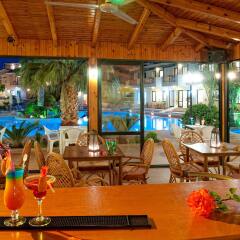 Отель Asterias Village Resort гостиничный бар