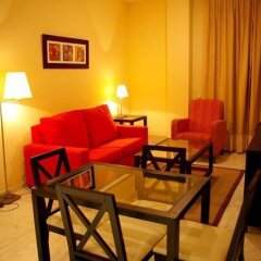 Отель Apartamentos Luxsevilla Palacio Испания, Севилья - отзывы, цены и фото номеров - забронировать отель Apartamentos Luxsevilla Palacio онлайн комната для гостей фото 4