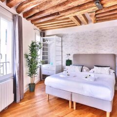 Апартаменты Amazing Apartment Close to Notre Dame Париж комната для гостей фото 2