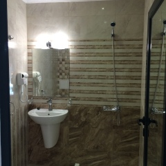 TM Deluxe Hotel ванная
