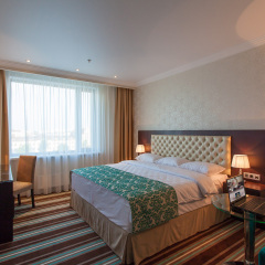 Гостиница Ramada by Wyndham Kazan City Centre в Казани - забронировать гостиницу Ramada by Wyndham Kazan City Centre, цены и фото номеров Казань комната для гостей фото 3