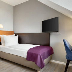 Отель Ramada by Wyndham München Airport Германия, Мюнхен - отзывы, цены и фото номеров - забронировать отель Ramada by Wyndham München Airport онлайн комната для гостей фото 2