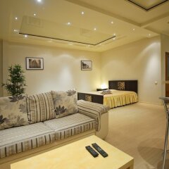 Апартаменты Berloga 55 Na Ulitse Frunze Apartments Омск комната для гостей фото 2