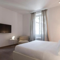 Отель Fifty Eight Suites Апартаменты Via Borgospesso 27 с различными типами кроватей