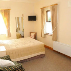Отель The Courtyard Guesthouse удобства в номере