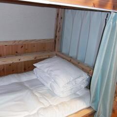 Отель Guesthouse Yakushima 2* Кровать в мужском общем номере фото 2