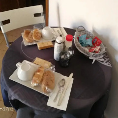 Отель La Perla B&B в номере фото 2