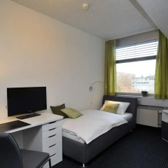 Отель Primestay Apartmenthaus Zurich Seebach комната для гостей фото 3