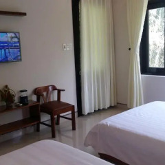 Отель CoCo Riverside Homestay Хойан удобства в номере