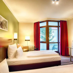 Отель Leonardo Hotel & Residenz München Германия, Мюнхен - 11 отзывов об отеле, цены и фото номеров - забронировать отель Leonardo Hotel & Residenz München онлайн комната для гостей фото 2