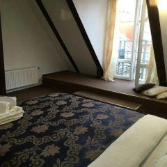 Отель Cozy Mansard in the Heart of Old Riga Латвия, Рига - отзывы, цены и фото номеров - забронировать отель Cozy Mansard in the Heart of Old Riga онлайн комната для гостей фото 3