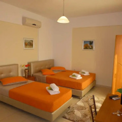 Апартаменты Pavloudis Apartments комната для гостей фото 4