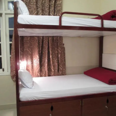 Отель Travelers Home Кровать в общем номере фото 3