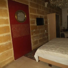 Отель Studio Apartment Marsaxlokk Мальта, Марсашлокк - отзывы, цены и фото номеров - забронировать отель Studio Apartment Marsaxlokk онлайн комната для гостей фото 3