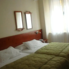 Отель Hostal Riesco Стандартный номер с различными типами кроватей фото 2