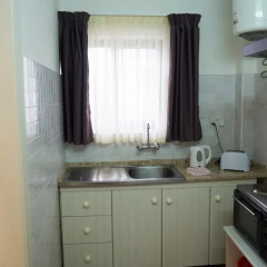 Апартаменты Huli And Apartments Каура в номере