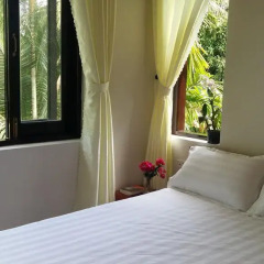 Отель CoCo Riverside Homestay Хойан комната для гостей фото 4