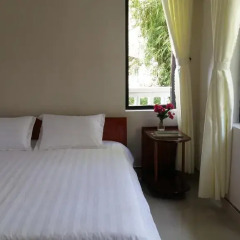 Отель CoCo Riverside Homestay Хойан комната для гостей фото 3