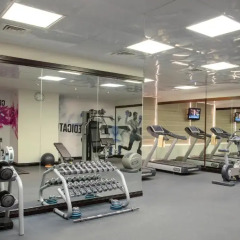 Отель Jumeira Rotana фитнесс-зал фото 3