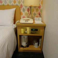 Hotel Wing International Kourakuen сейф в номере