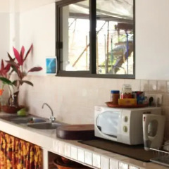Отель Taharuu Surf Lodge в номере
