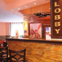 Апартаменты Polaris Inn Apartments гостиничный бар