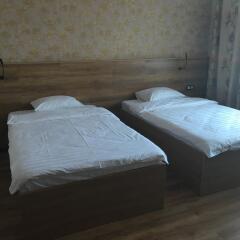 Гостиница Postoyaliy Dvor Inn в Уссурийске отзывы, цены и фото номеров - забронировать гостиницу Postoyaliy Dvor Inn онлайн Уссурийск комната для гостей фото 4