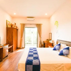 Отель Tra Que Riverside Homestay 2* Улучшенный номер с различными типами кроватей фото 5