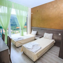 Отель Kaltsunova house Банско комната для гостей фото 4
