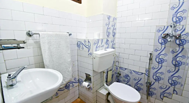 Кровать в общем номере The Hotel Pleasure Home Inn