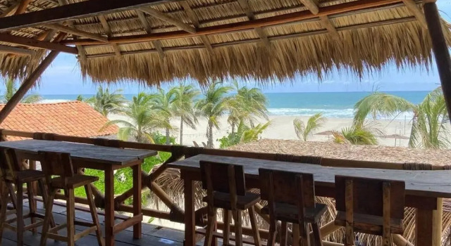 Кровать в общем номере Secret Spot by Palapita Beach House