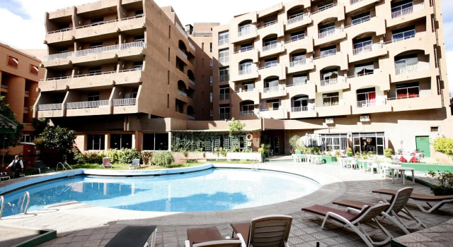 Кровать в общем номере Hotel Agdal