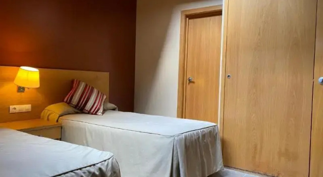 Кровать в общем номере с 2 комнатами Aparthotel Siente Boí & SPA