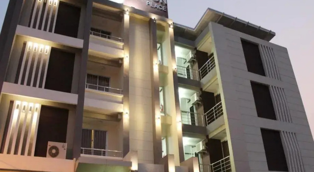 Кровать в общем номере Triton Hotel Nakhonratchasima โรงแรมไททัน