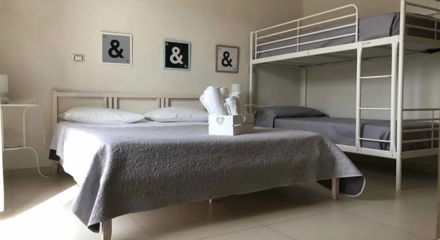 Четырёхместный номер Deluxe с балконом B&B La Via di Casa