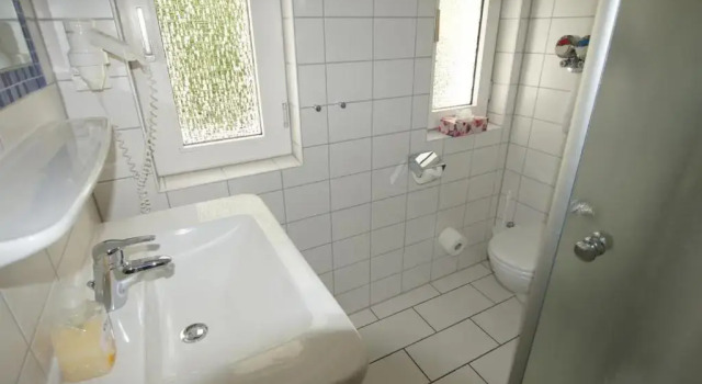 Апартаменты Ferienwohnung 4 Rosenbogen - Familienwohnung mit Wintergarten und Terrasse