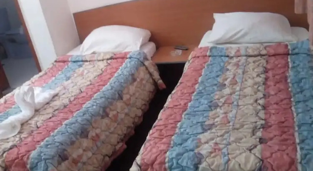 Кровать в общем номере с видом на город Invitation Hotel